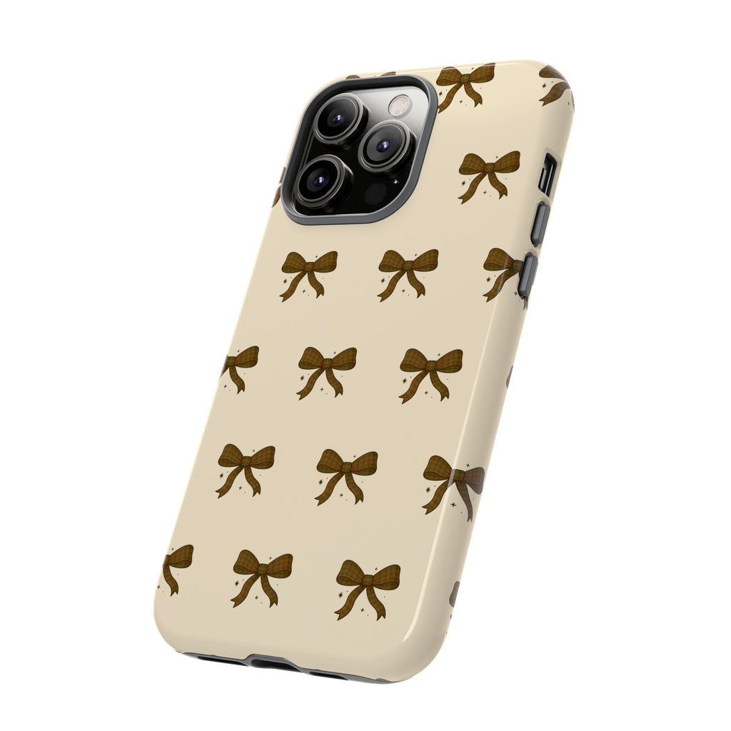 Christmas Tough Phone case with brown bow pattern on a beige background