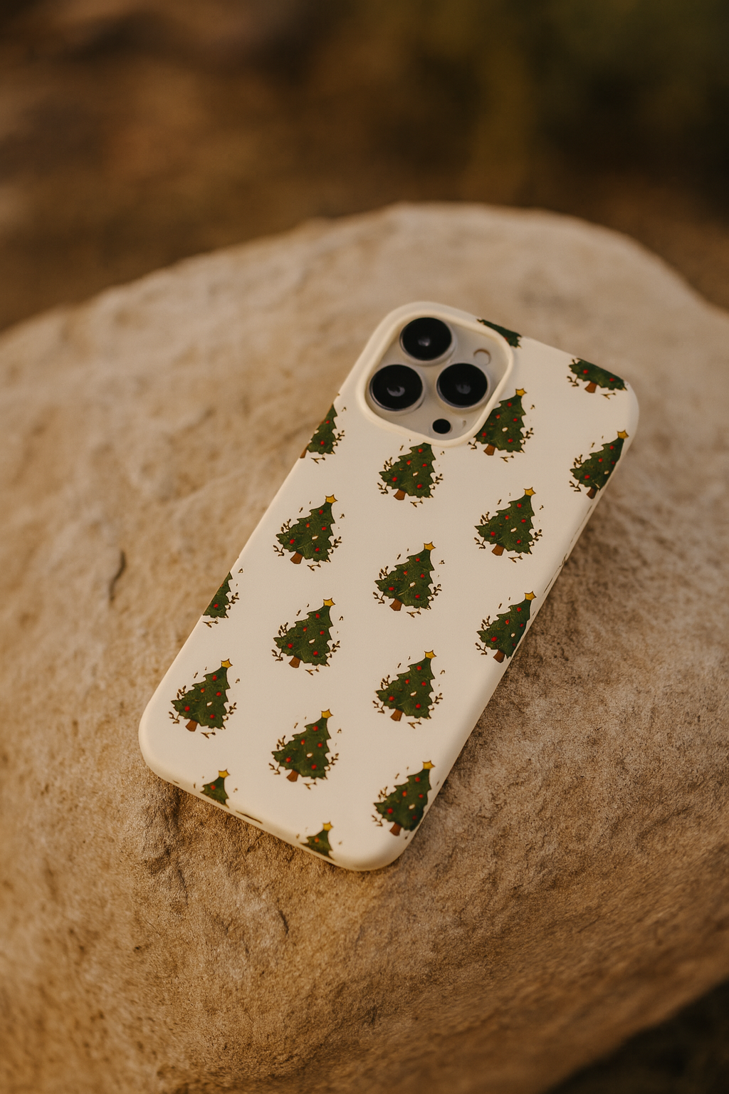 Phone case with Christmas tree pattern on a stone surface